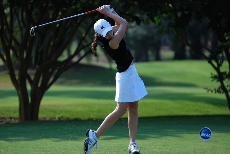 A North Central College golfer tees off with an iron at the NCAA Women’s Golf Championship in 2011. 