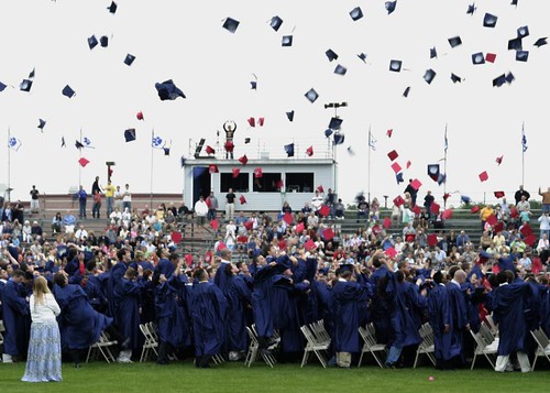 Hundreds of high school seniors throw their caps up in joy at the end of graduation, enjoying a moment that is coming soon for CTs own seniors.