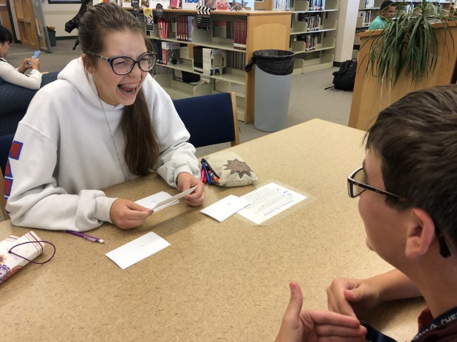 Check it out. In order to study for their upcoming Spanish test, Madison Dragon (10) and Austin Elberg (10) work on flashcards in the library during the second week of school. “I do homework in the library a lot and [the supplies] are always helpful for getting things done,” Dragon said. 