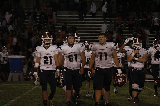 Strutting onto the field before the game, the varsity football players look determined - jaws set and eyes focused. Many high school players dream of an opportunity to play Division 1 in college, but how will this new idea shift the process? 
Photo by Thomas Wynne