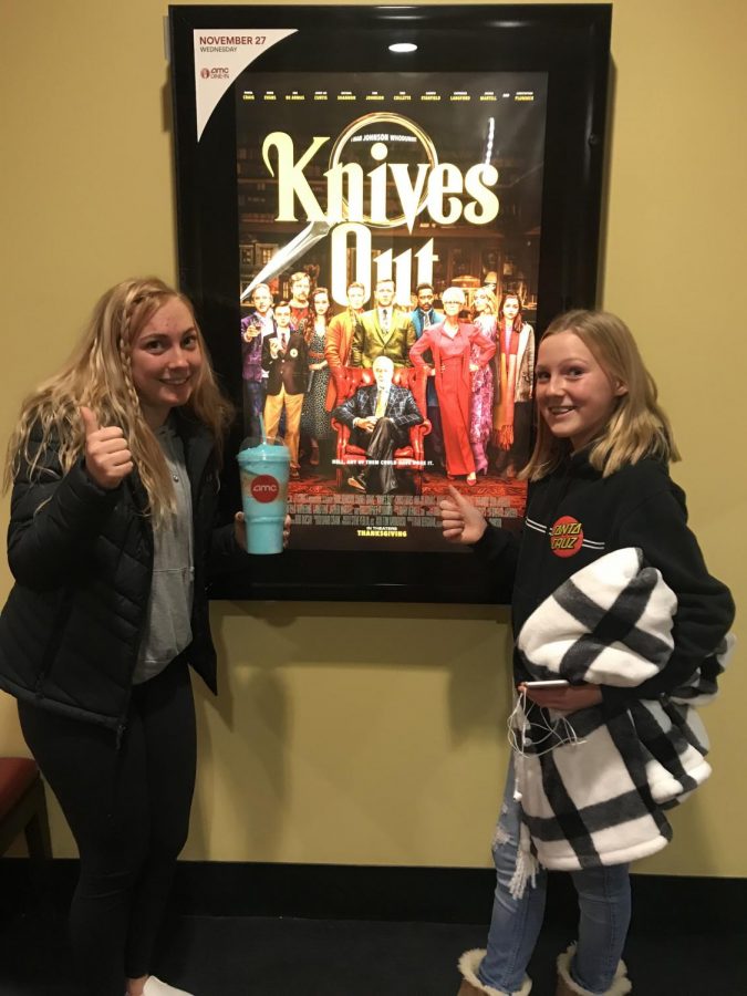 Popping two thumbs up for Knives Out, the latest crime drama in theaters this past week, Elyse Sommer and her youngest sister smile in front of the promotional poster at AMC Southlands before viewing the film.  The movie, originally written by Agatha Christie as a novel, features Daniel Craig (007 extraordinaire), Chris Evans (did someone say Captain America?), and Ana de Armas (another former James Bond star) in a set straight from a historic Victorian melodrama. 