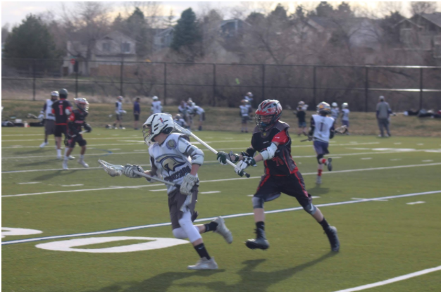 C.J. Vigil, a sophomore playing lacrosse on a chilly fall day.  C.J has always loved lacrosse and this passion is what drives him to play for Cherokee Trail, 
“ My favorite thing about lacrosse is definitely teamwork,”  explained Vigil.  Teamwork is one of the main reasons sports are popular and why fans like to cheer them on.   
Photo Credit unknown
