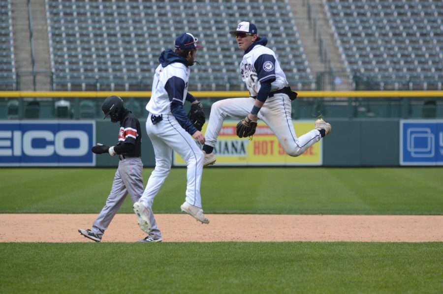 Brett Barber (12) and Braedan Reichert (10) jump for joy after a hard fought win at Coors Field. Barber will continue his baseball career at Garden City Community College next year. 