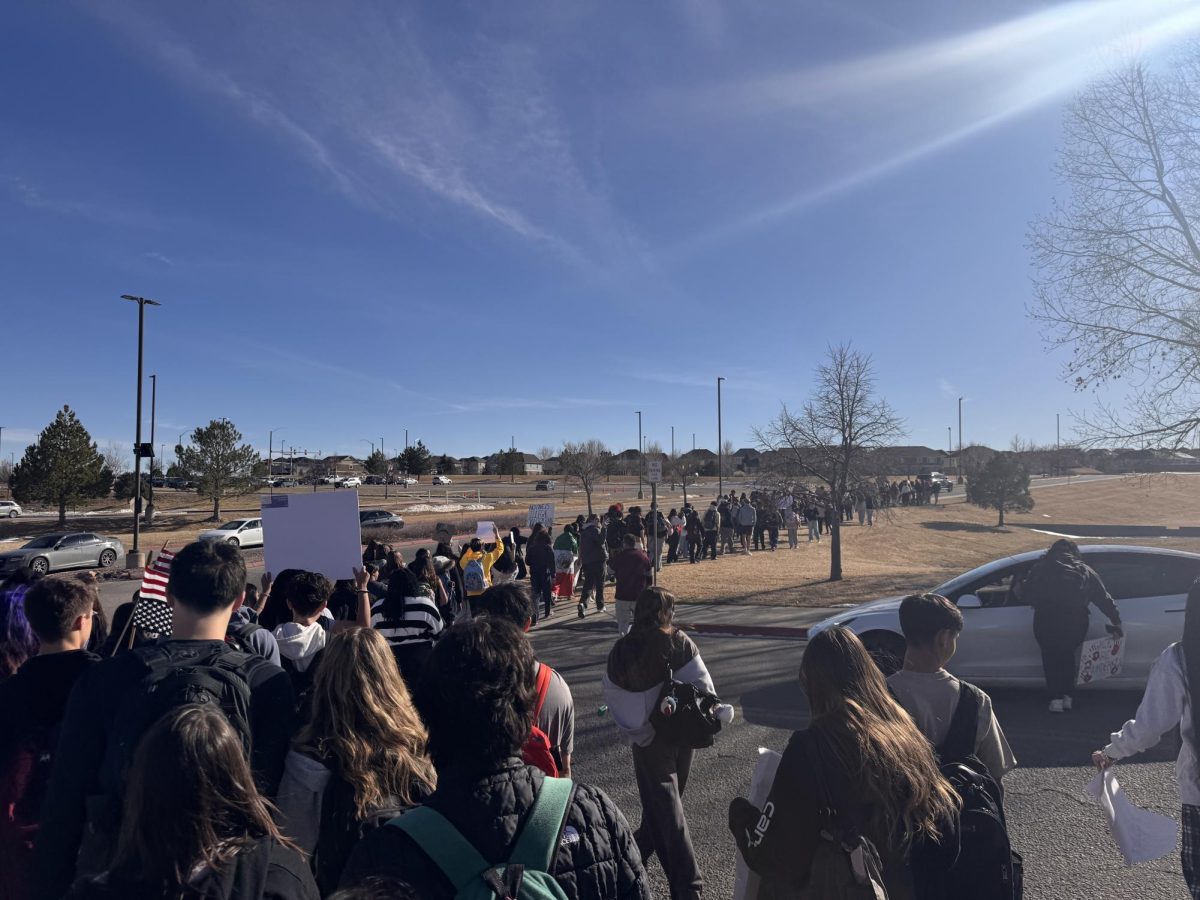 Photo taken at the scene of the protest. Students march from the parking lot to the main road to continue the protest up the street.
