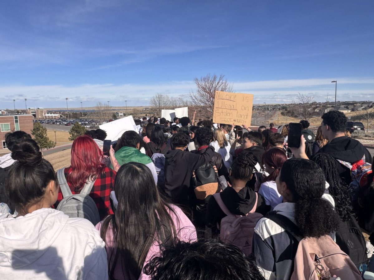 Photo from the scene of the protest. Students marching up the main road to continue protesting. 
